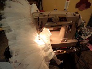 The Haywoods do Fancy Dress sewing the frills