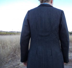The Aquascutum Suit pinned in sleeves unflattering back view