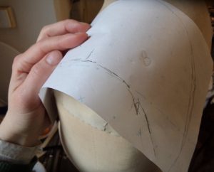 That old dressmakers model making a shoulder piece pattern