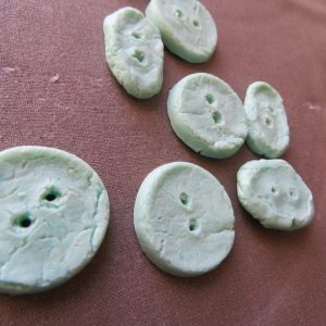 Buttons made from milk plastic at home