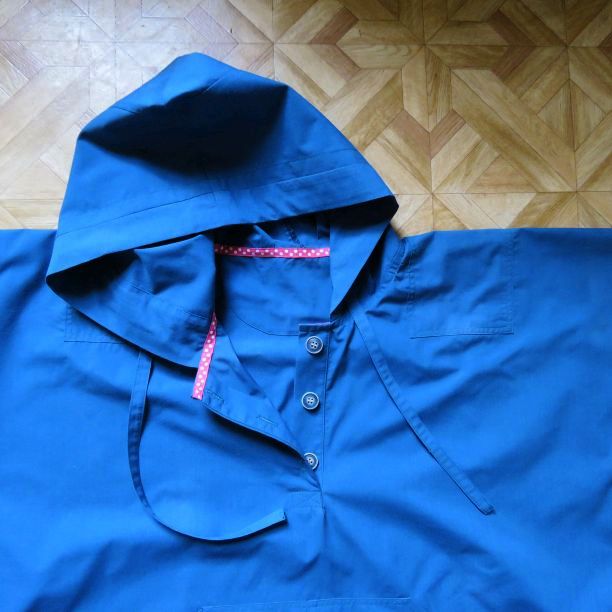 photo of blue poplin hoodie laid flat