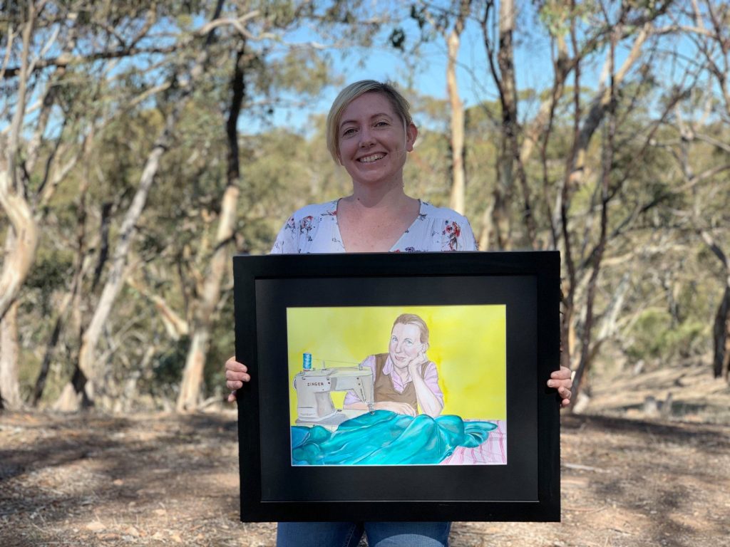 Meg Mader with portrait of Liz Haywood