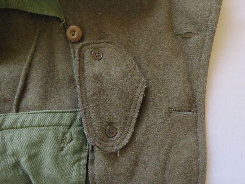 Throat latch buttoned to inside the coat's front