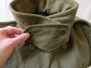 Storm flap on collar of army coat