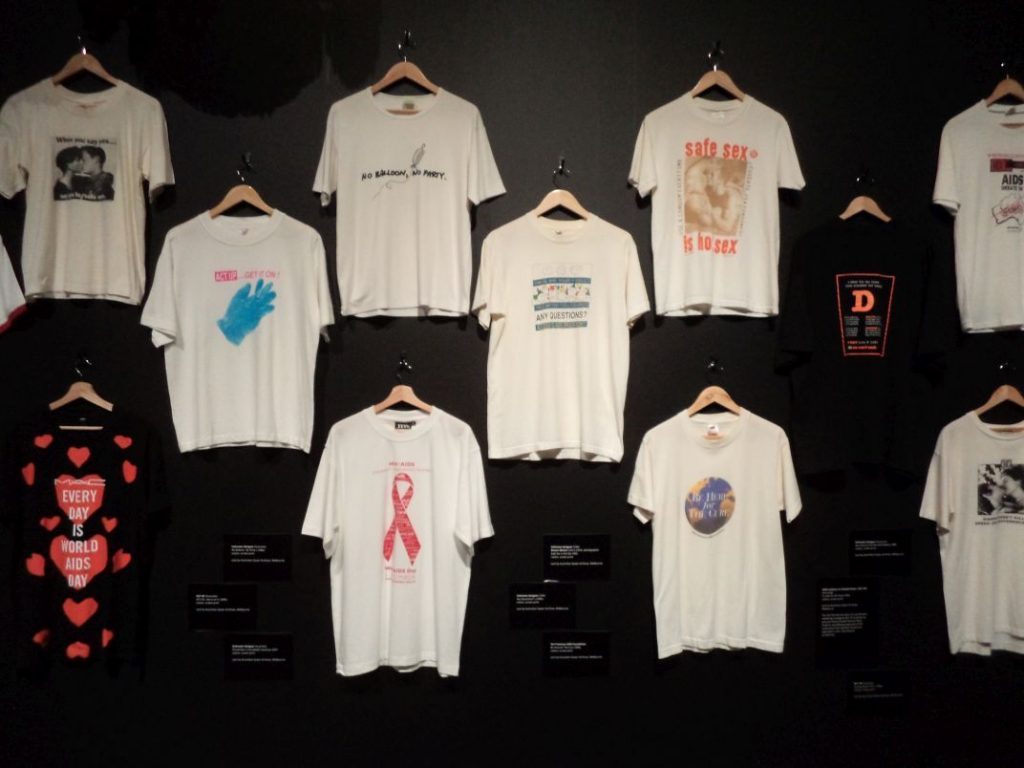Wall of t-shirts with political and safe sex messages