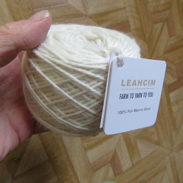 Ball of white Leahcim merino yarn.