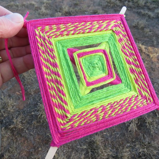 Mandala in hot pink and lime green yarn.